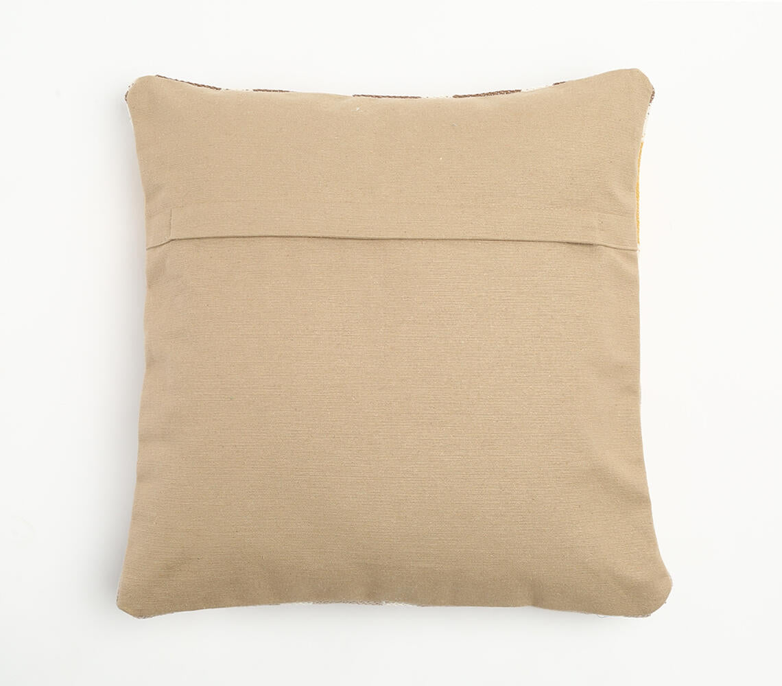 Den släta beige baksidan av det geometriska kuddfodralet