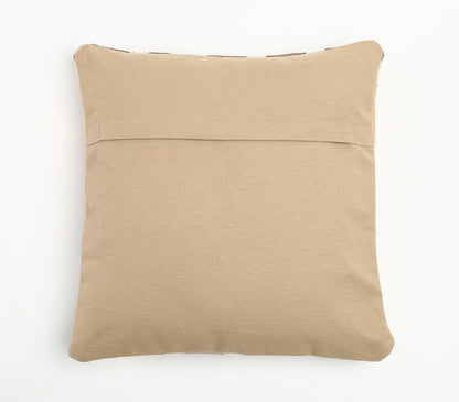 Den släta beige baksidan av det geometriska kuddfodralet
